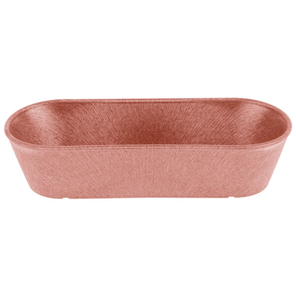 A pink rectangular HS Inc. paprika cracker and breadstick basket on a white counter.