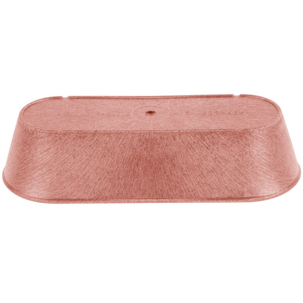 A copper-colored metal HS Inc. breadstick basket on a wooden surface.