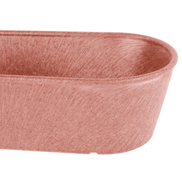 A metal basket with a handle filled with breadsticks.