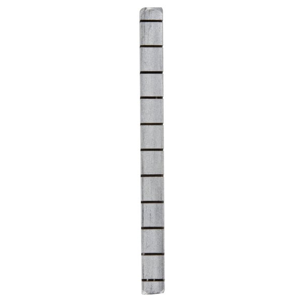 A metal blade spacer with black lines on it.