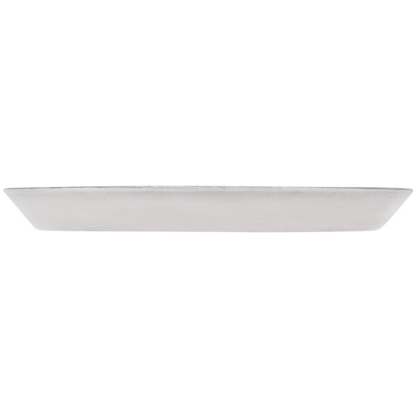 An American Metalcraft heavy weight aluminum pizza pan with a perforated bottom on a white surface.