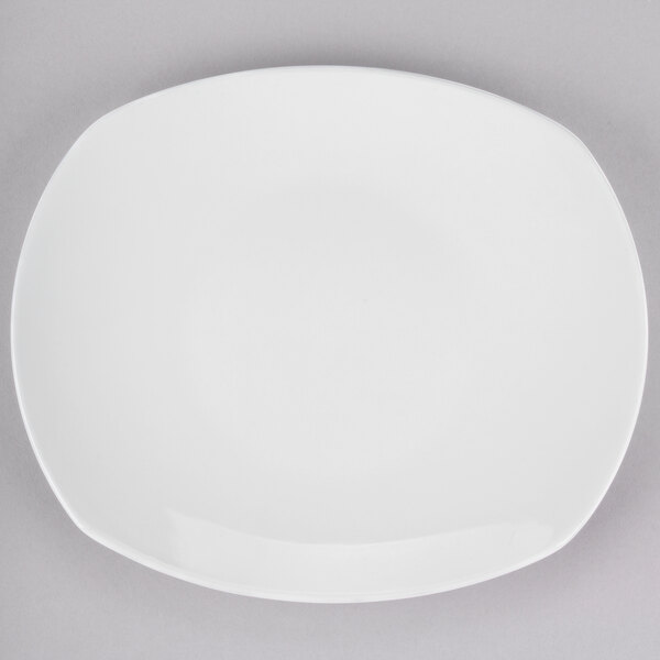 A Tuxton white china plate with a small rim.