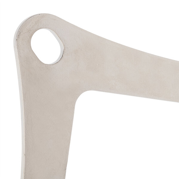 A white metal Nemco Blade Plate with a hole in it.