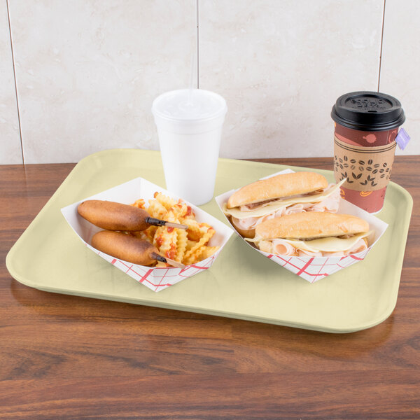 A Carlisle Glasteel tray with a hot dog, sandwich, and drink on it.