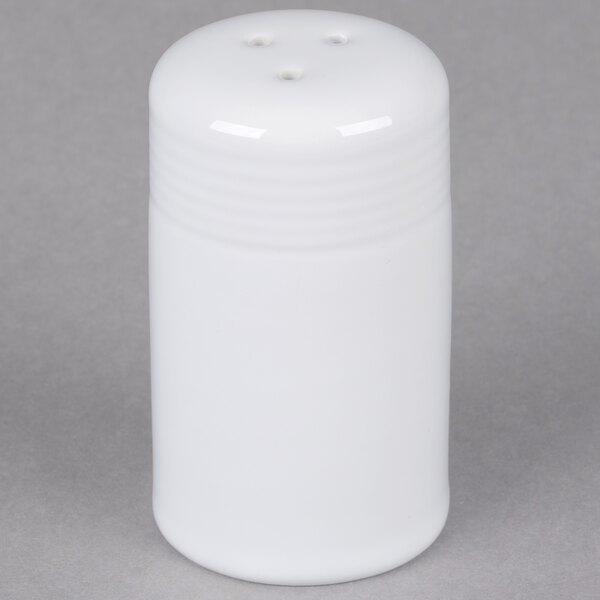 A white Tuxton pepper shaker.