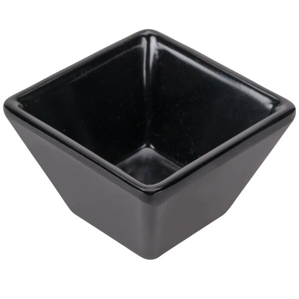 a black square bowl with a white background