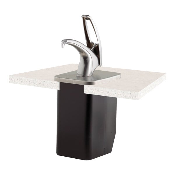 A San Jamar FrontLine in-counter condiment dispenser system on a metal counter with a faucet.