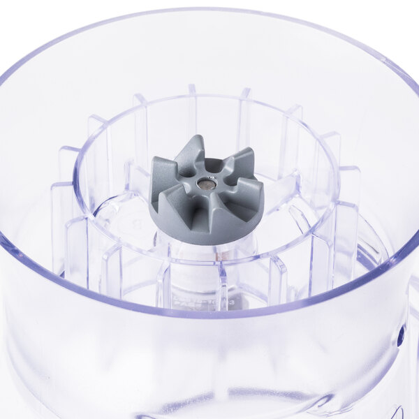 A Proctor Silex plastic blender container with a grey blade inside.