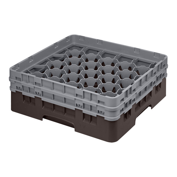 A brown Cambro plastic glass rack with 30 compartments.