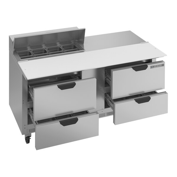 A silver Beverage-Air refrigerator with 4 drawers and a metal grid on the counter.