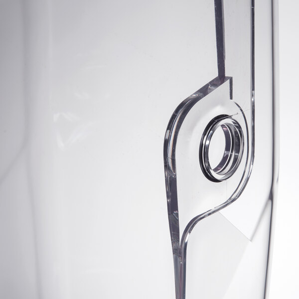 A clear plastic sound enclosure with a hole in it.