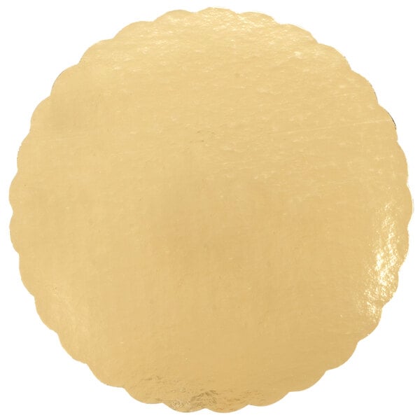 A gold laminated corrugated cake circle with a white background.