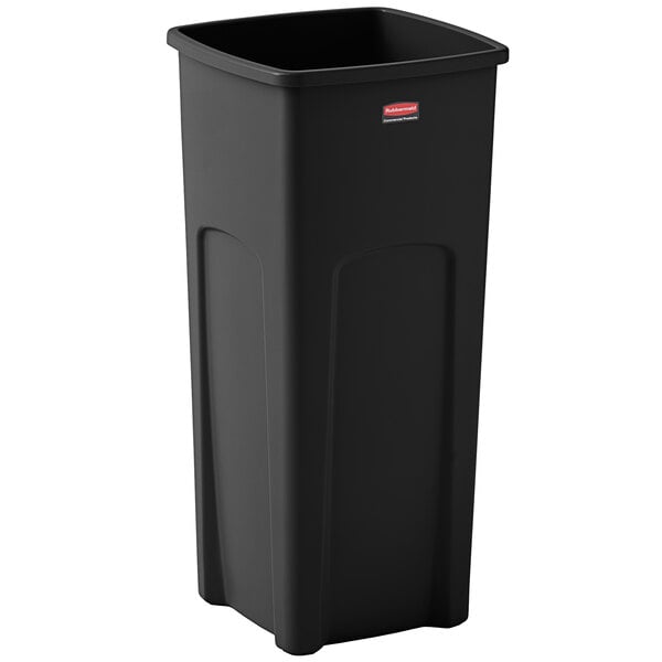 A black Rubbermaid square trash can.