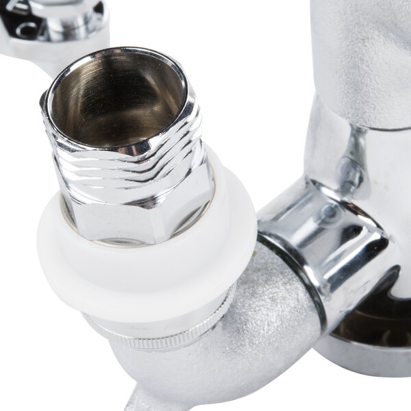 A close-up of a T&S chrome service sink faucet with a vacuum breaker nozzle.