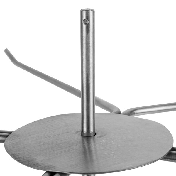 A metal pole in a metal plate with a round base.