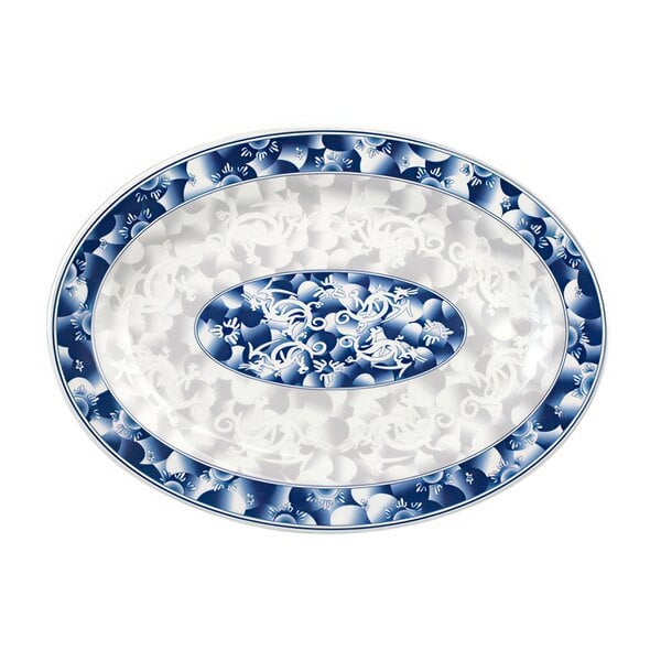 A blue and white oval Thunder Group melamine platter with a dragon design.