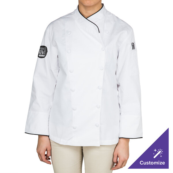 A woman wearing a white Chef Revival executive chef coat with black piping.