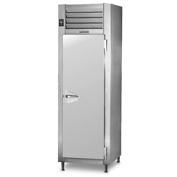 A Traulsen stainless steel reach-in refrigerator with a door open.