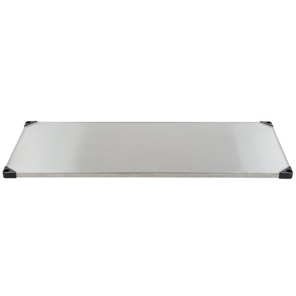 a rectangular metal plate with black corners