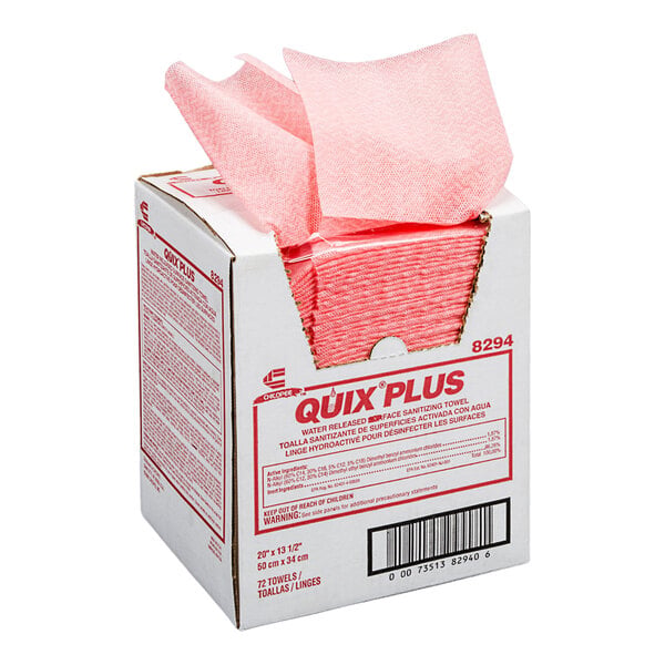 A white box with pink towels being dispensed from the top opening, labeled 'QUIX PLUS' and containing 72 medium-duty sanitizing towels.