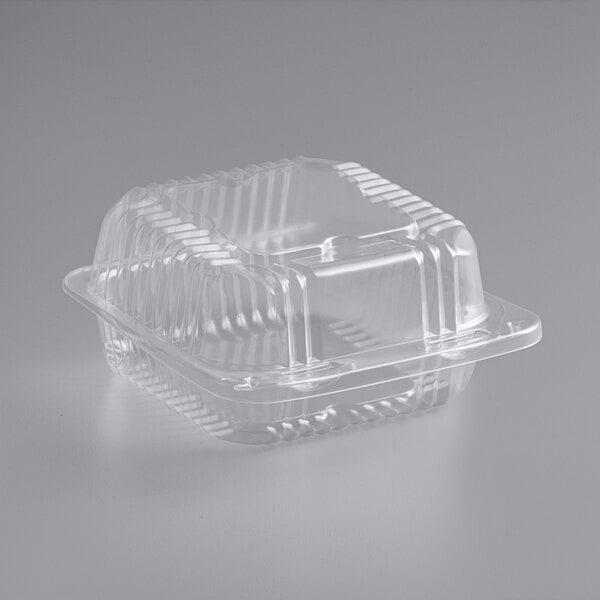 A Durable Packaging clear hinged lid plastic container.