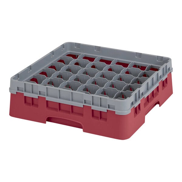 A red and grey plastic Cambro glass rack with several compartments.