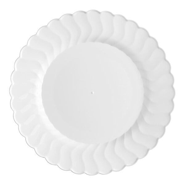 A white Fineline Flairware plastic plate with a scalloped edge.