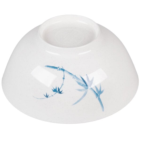 A white bowl with blue bamboo designs.
