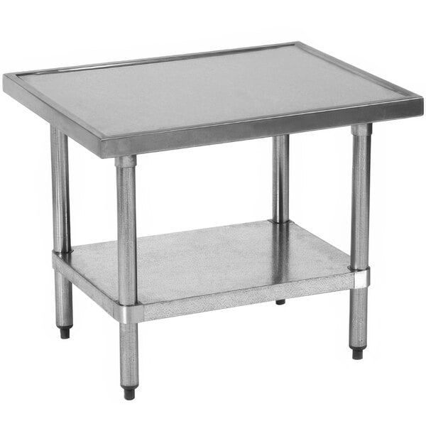A Globe stainless steel mixer table with galvanized undershelf on a table in a professional kitchen.