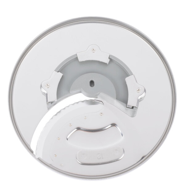 A white metal circular object with a circular blade in the middle.