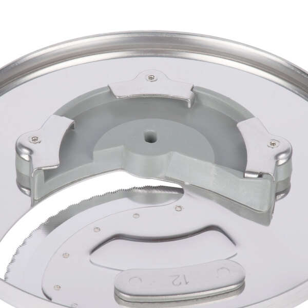 A Waring stainless steel circular slicing disc.