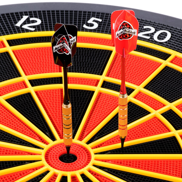 An Arachnid electronic dart board with darts in the center.
