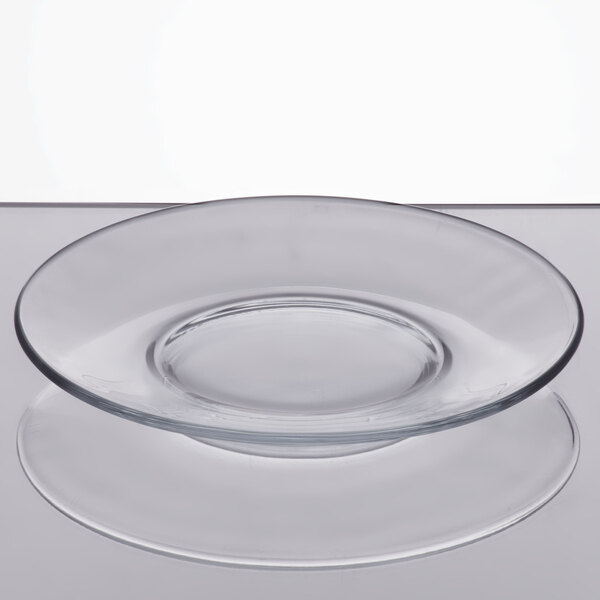 An Anchor Hocking clear glass plate with a circular rim.