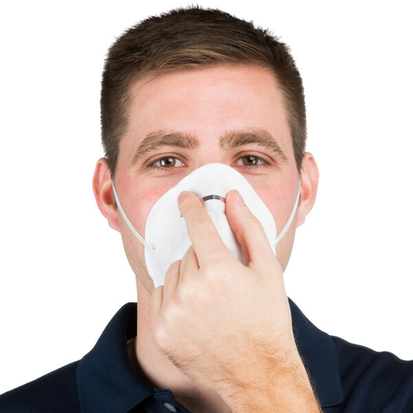 a person with a white face mask