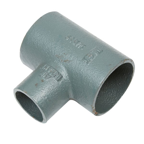 A grey pipe with a nozzle connected to a Watts WD-25 Grease Trap.