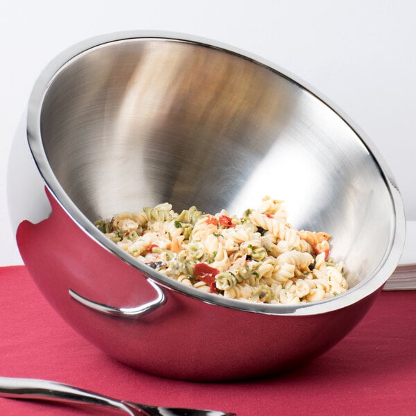 An American Metalcraft stainless steel double wall insulated bowl filled with pasta and sauce on a table.