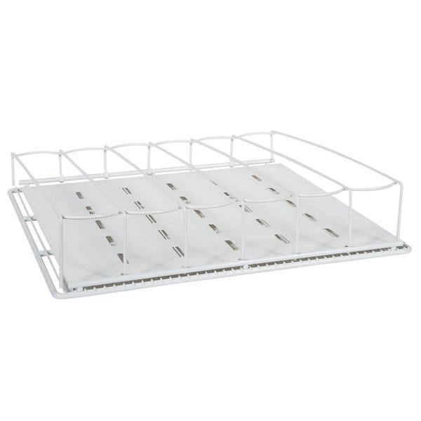 A white metal shelf with metal bars and four white trays on it.