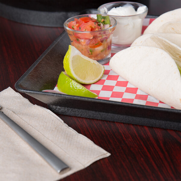 A HS Inc. charcoal square deli server holding tacos and salsa on a table.