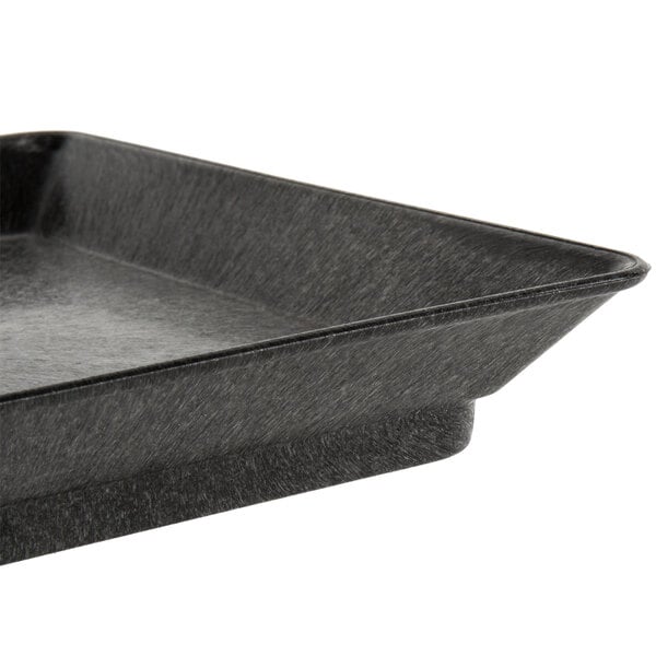 A black rectangular tray with a handle.
