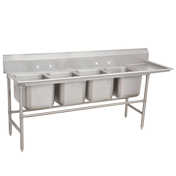 A stainless steel Advance Tabco four compartment pot sink with right drainboard.