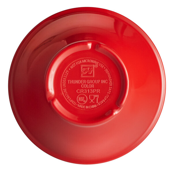 A close-up of a red Thunder Group melamine bouillon cup.