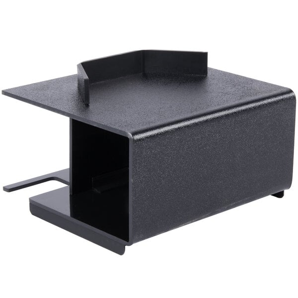 A black rectangular metal box with a hole in the top.