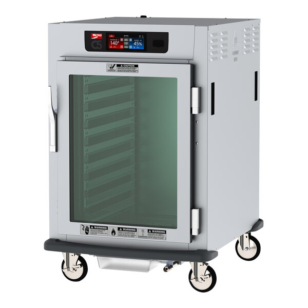 A white Metro C5 9 Series pass-through heated holding and proofing cabinet with clear doors.