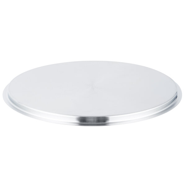 A stainless steel cover with a circular edge and round surface.