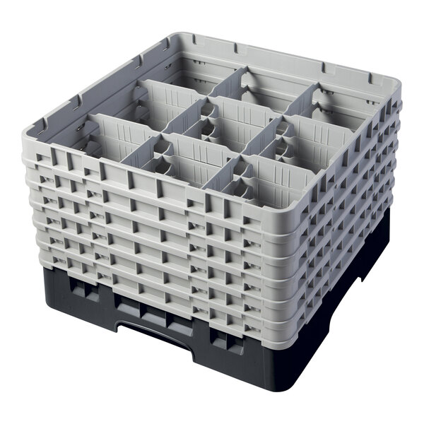 A black plastic Cambro glass rack with 9 compartments and 6 extenders.