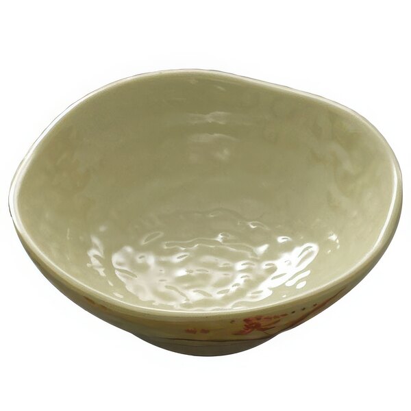 A white bowl with a gold orchid design on the surface.