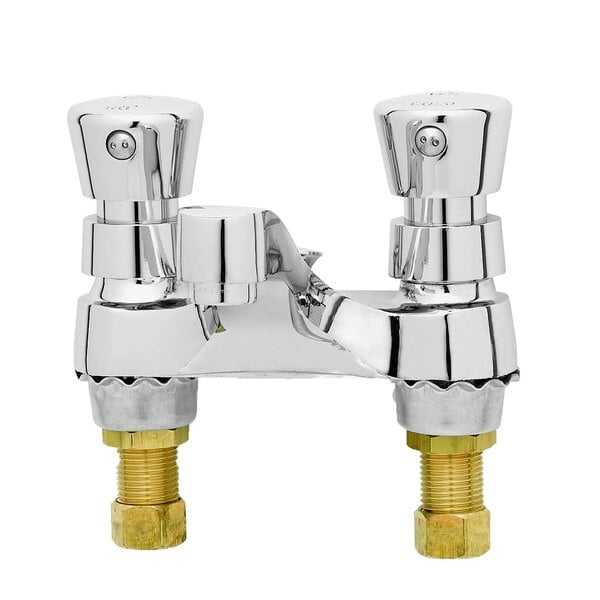 A T&S deck mounted metering faucet with two brass handles.