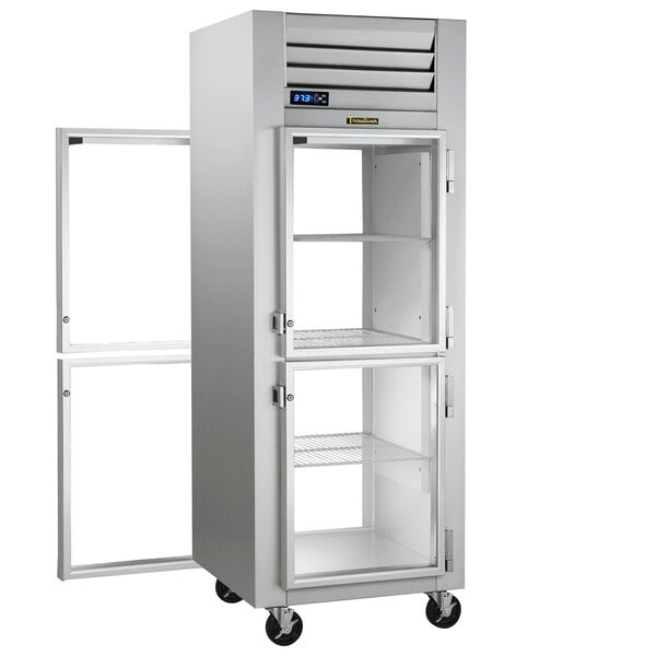 A white metal Traulsen reach-in refrigerator with half glass doors.