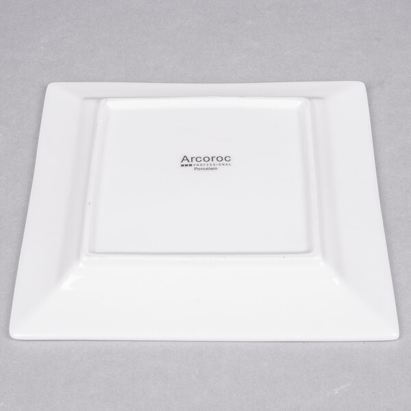 A white square Arcoroc porcelain plate.