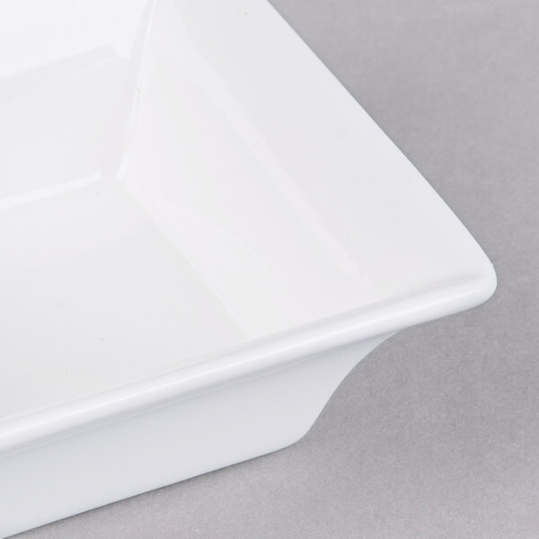 An Arcoroc white square flared bowl.
